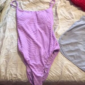 Woman’s purple tiger style print body suit